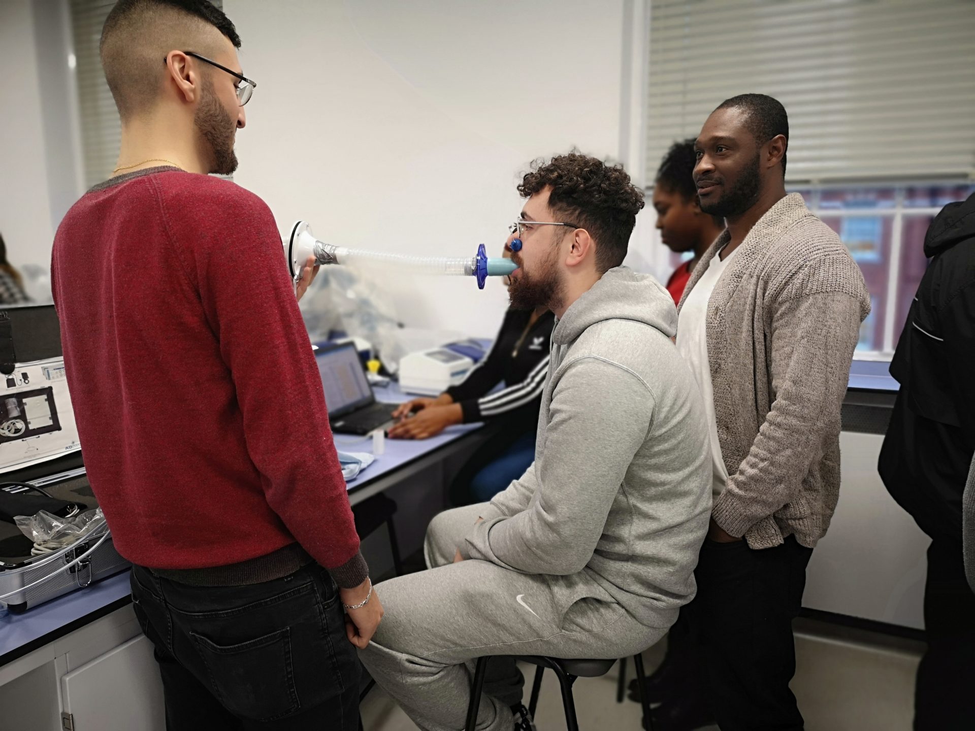 Students undertaking a spirometry experiment in a physiology teaching practical.