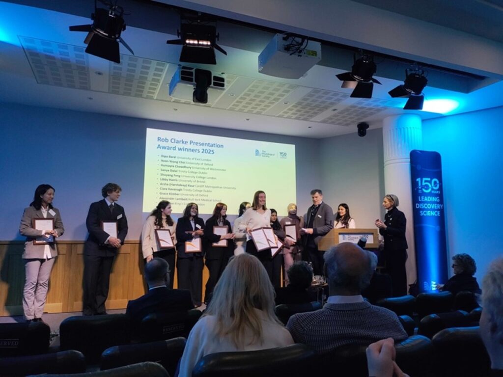 Grace on stage with the all the 2025 Rob Clarke Award finalists during the award ceremony.